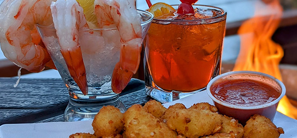 Appetizers such as shrimp cocktails and cheese curds to start your meal at Ravinia Bay in Wisconsin Dells